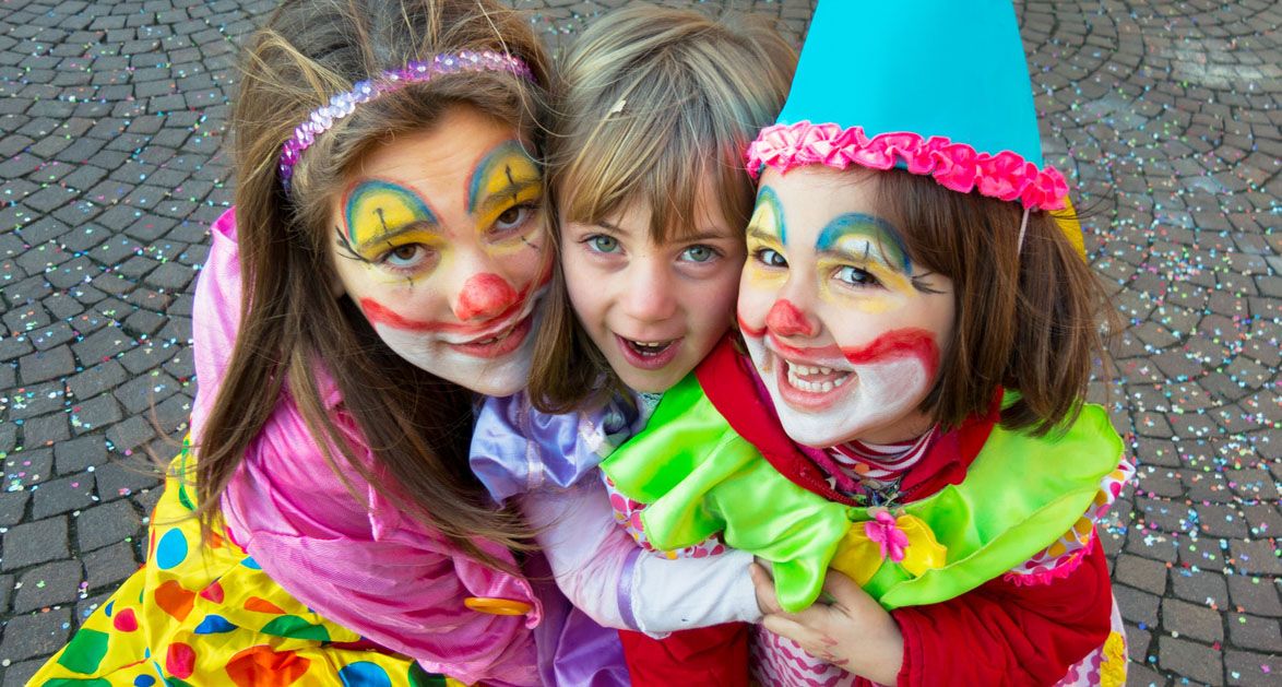 Three Nice Italian Children With Dresses And Makeup For Carnival